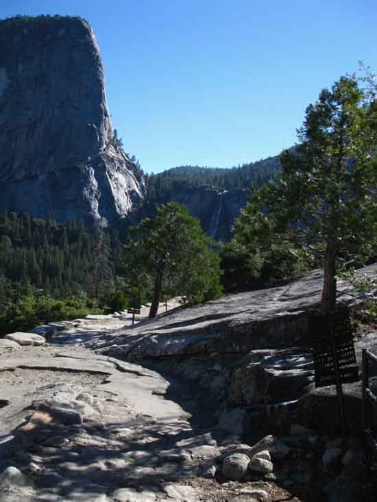 Stepping down unto Clark Point from Nevada Falls on the JMT.