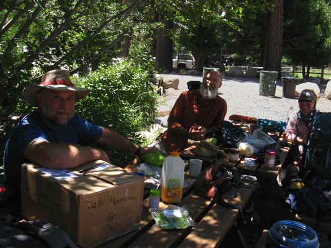 PCT hikers packing their resupply into their packs and bellies for next section of their hike North.