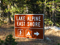 Lake Alpine Sign pointing to the Silver Trailhead, where the Tahoe to Yosemite Trail continues South