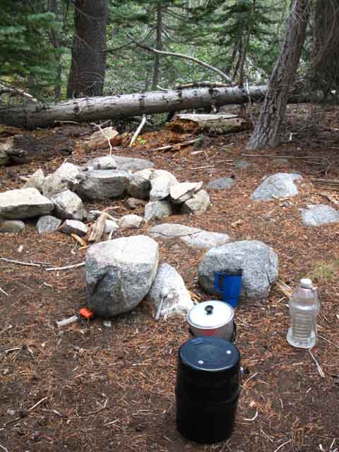 Rock seat and fire ring at Summit City Creek campsite above Horse Canyon.