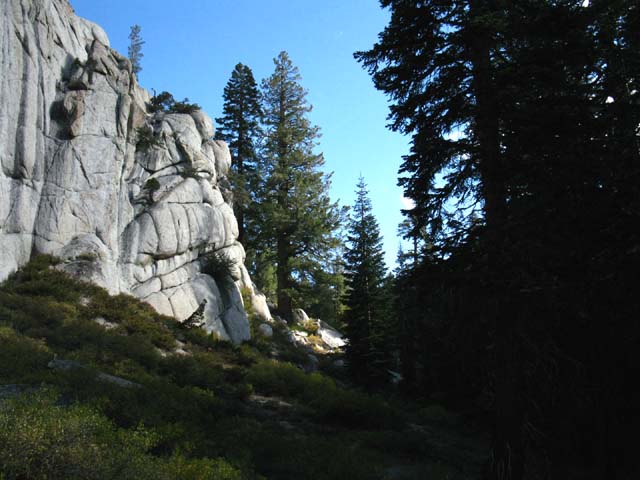 Trail aound rock feature fades.