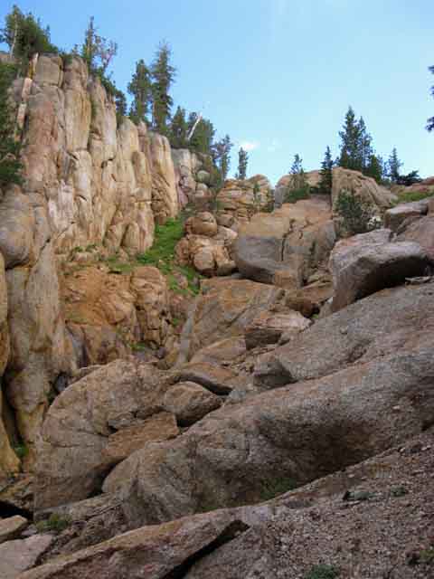 Slot in the wall of cliffs surrounding headwaters of the Clarks Fork on the TYT.