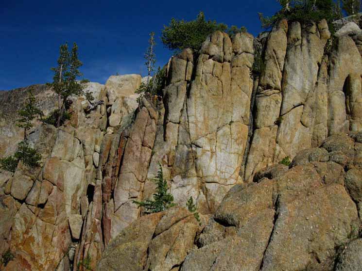 Granite cliffs along route between Clarks Fork River and the headwaters bowl.