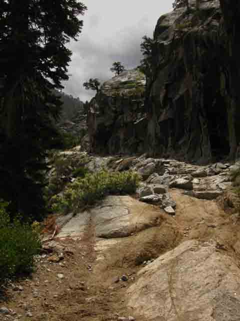 Tahoe to Yosemite Trail carved out of solid rock of canyon wall.