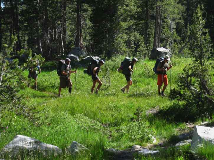 A conglomoration of PCT hikers approaches.