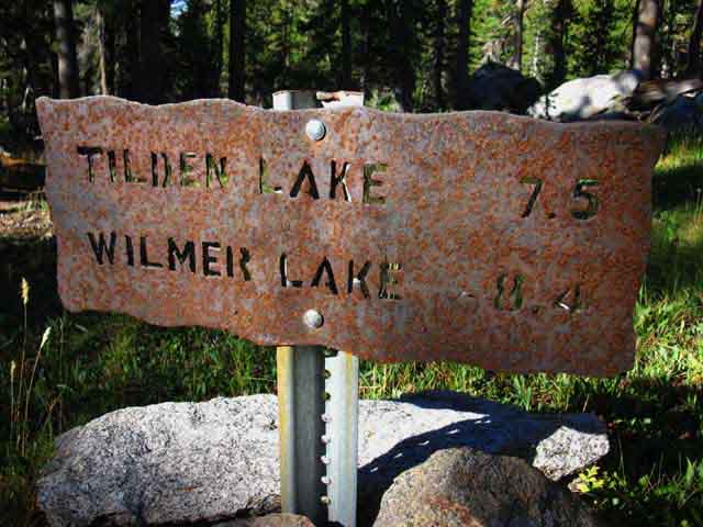 Yosemite trail junction sign with miles, Jack Main Canyon to Tilden and Wilmer Lakes.