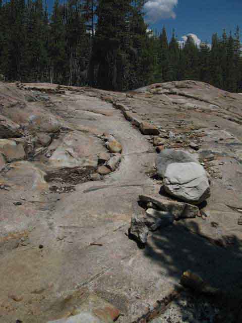 Trail polishing granite terrain.