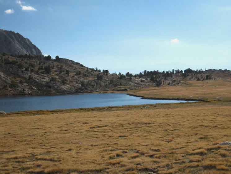 Fletcher Peak beyond Evelyn Lake marks the position of Vogelsang High Sierra Camp.