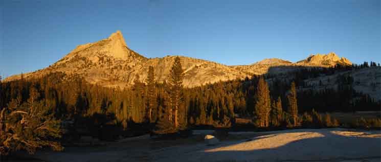 Cathedral Peak, the rounded crestline of Peak 11168 and Echo Peaks in Sunset's amber glow. 