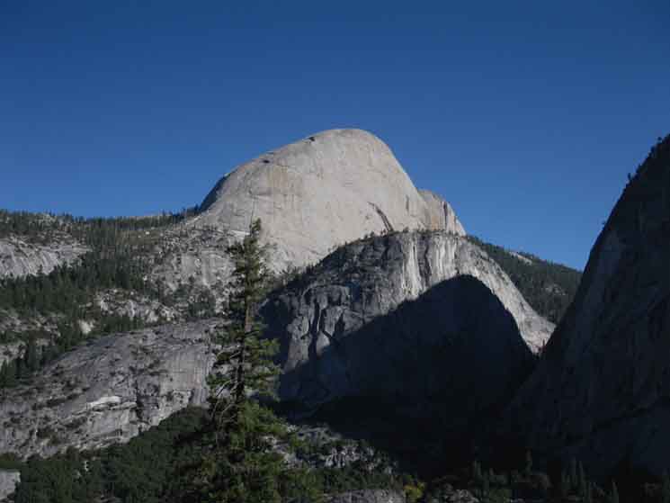 Shifting perspective of alingment of Half Dome, Mount Broderick, and Liberty Cap.