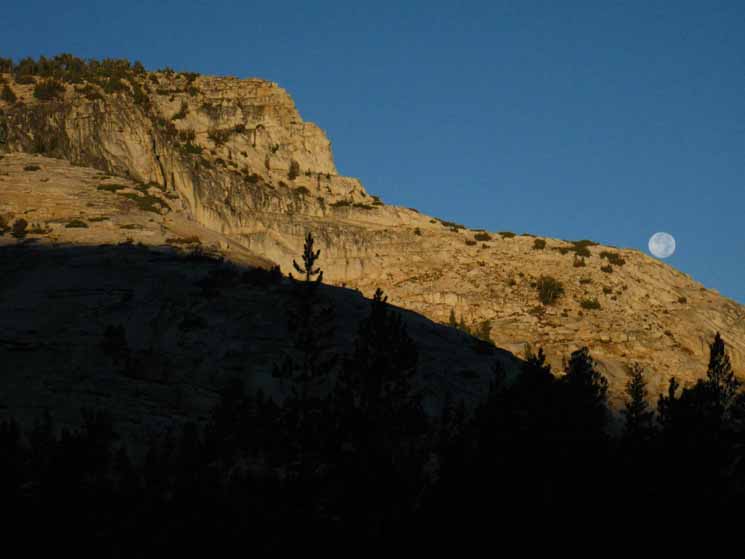 Moon approaching setting behind Upper Cathedral Lake, Yosemite.