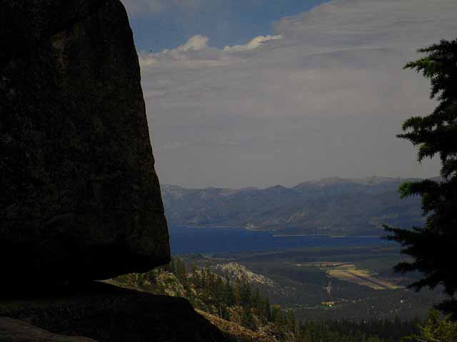 Just Brief Glimpses of Lake Tahoe and South Lake Tahoe appear through rock and forest